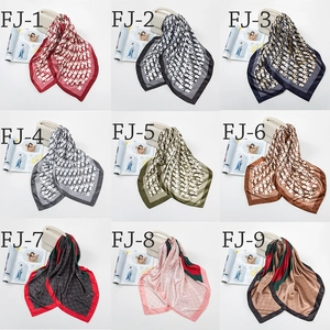 Grid display showing nine satin square scarves with various elegant printed patterns