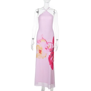 Detail of pink halter neck maxi dress with yellow floral print and semi-sheer fabric texture