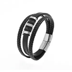 Detail view of multi-layer black leather bracelet with silver metal rings and magnetic clasp