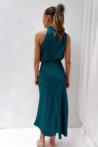 Detail of teal satin evening dress showing the back zipper and silky drape fabric