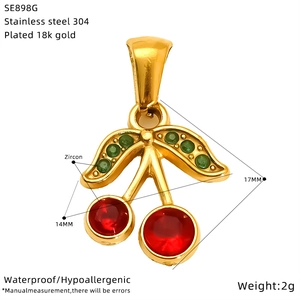 Macro detail of cherry pendant in 18k gold plated 304 stainless steel with zircons