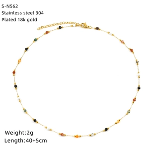 Close-up of 18k gold plated stainless steel necklace with colorful turquoise beads
