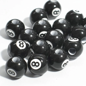 Macro view of acrylic black billiard number 8 round loose beads for jewelry making