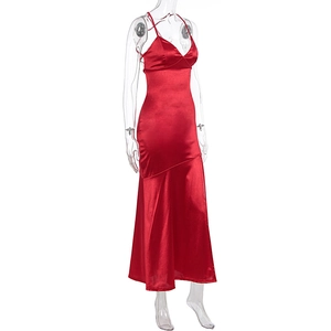 Detail of red satin dress featuring a low V-neck and smooth lustrous fabric texture
