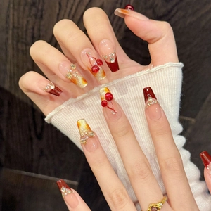 Handmade cherry red gradient press-on nails with 3D cherry accents and rhinestones