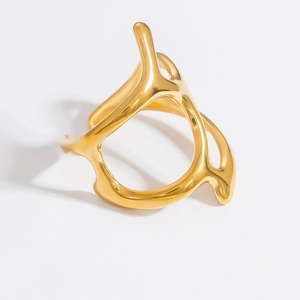 Detail of liquid metal style open cuff bracelet with 18k gold plating and high polish finish
