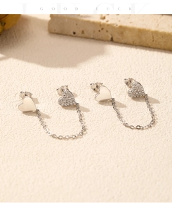 Detail view of S925 sterling silver heart chain earrings with sparkling cubic zirconia