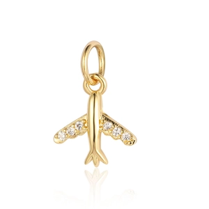 Detailed view of a gold plane pendant with sparkling zircon inlays and smooth reflection