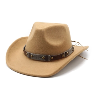 Detail of camel wool western cowboy hat with studded leather band and woven trim decoration