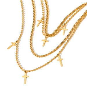 Gold layered necklace with cross pendants and mixed bead chains for hip hop style