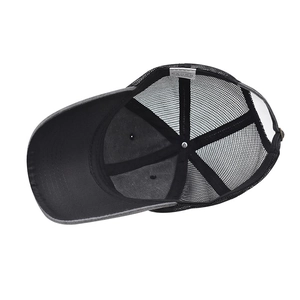 Detail view of cotton mesh baseball cap interior with stitching and washing label