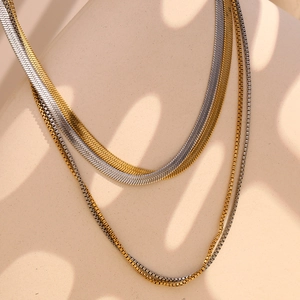 Double-layered 18K gold and silver snake chain necklaces with polished finish