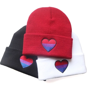 Rainbow heart embroidered beanies in red, black and white colors for a trendy hip-hop style