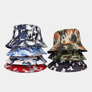 Close-up showing various camouflage bucket hats stacked in diverse vibrant color patterns