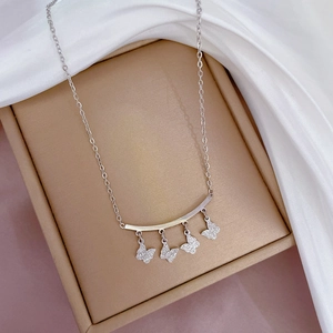 Titanium steel silver necklace with four diamond-studded butterfly pendants on silk