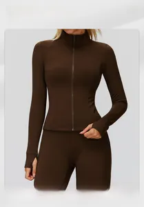 Detail of slim-fit brown zip-up sports jacket with stand collar and thumbhole sleeves