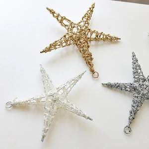 Sparkly iron star ornaments in gold, silver, and iridescent white for Christmas decor
