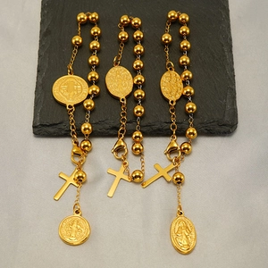 Polished gold stainless steel religious bead bracelet featuring crucifix and saint medallions