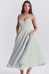 Detail view of light blue floral dress showing a layered hem with white tulle underskirt