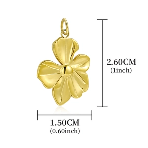 Polished gold flower pendant detail showing 2.6cm height and 1.5cm width dimensions