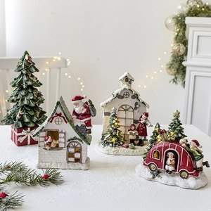 Miniature resin Christmas tree and vintage camper ornaments with warm LED lighting