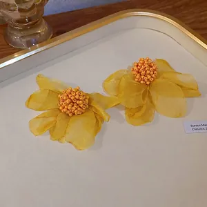 French vintage floral cluster earrings with yellow organza petals and bead details