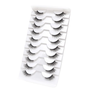 10 pairs of natural cat eye false eyelashes on a white tray with a clear studio background
