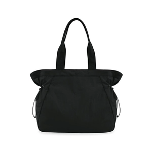 Detail showing water-resistant black tote bag with adjustable drawstring side closure