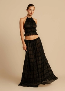 Detail of layered black chiffon ruffles on halter top and matching maxi skirt set
