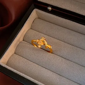 Vintage gold snake ring with scale texture displayed in a premium jewelry box