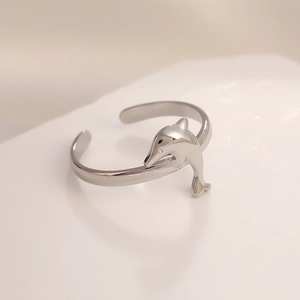 Adjustable silver stainless steel open ring featuring a polished dolphin charm pendant