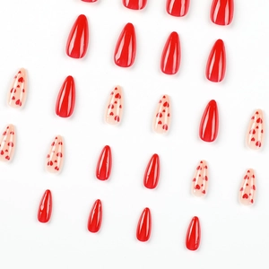 Red heart press-on nails in long stiletto shape for Valentine's Day manicure set