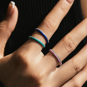 Three S925 sterling silver colorful enamel rings with small diamonds on fingers