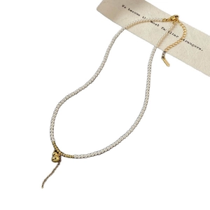 Elegant pearl necklace with gold gourd pendant and zircon accents on white background