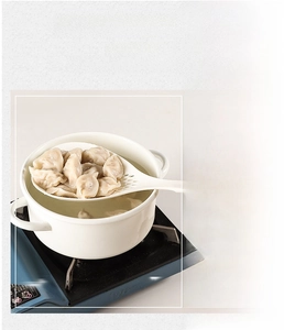 White heat-resistant slotted spoon with long handle, temperature range -20℃ to 210℃
