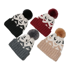 Winter mohair knit beanie set with geometric patterns and large fluffy pom-poms