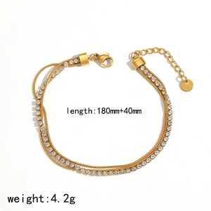 Bracelet double couche en acier inoxydable doré orné de strass blancs et d'une extension
