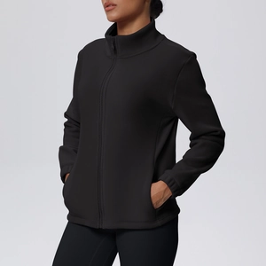 Detail of slim-fit fleece jacket featuring stand collar, zip-up front and side pockets