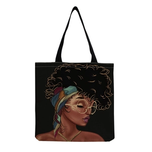 Detail of artistic African woman print with bohemian headband on black canvas tote bag