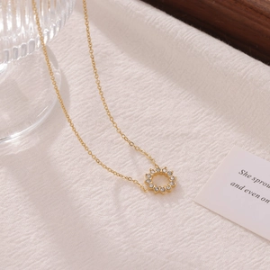 Elegant gold sunflower zircon necklace with circular pendant on minimalist o-chain