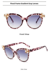 Detail of tortoise sunglasses with rhinestone borders and pearl floral accents