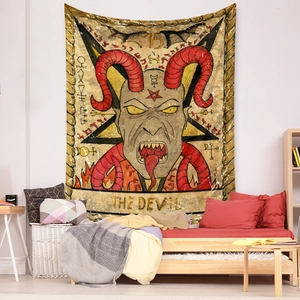Detail of The Devil tarot tapestry showing vintage red devil print in a bedroom