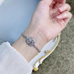 Detailed view of an S925 silver rose bracelet with sparkling white zircons on a wrist