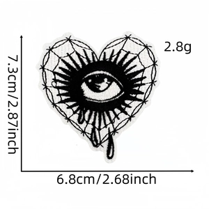 Detailed size specifications for heart-shaped eyeball embroidery patch measuring 7.3x6.8cm
