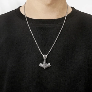 Close-up of men's Viking Mjolnir pendant with Celtic knots on a box chain