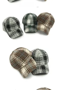 Detailed view of structured plaid baseball caps in black, green, and brown color options