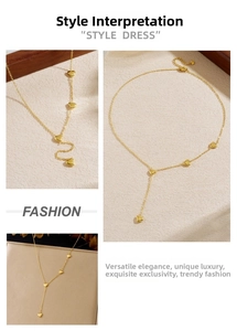 Detail view of heart-shaped pendants on a gold-plated stainless steel Y-shaped chain