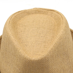 Close-up of the woven straw texture and contoured top of this stylish sun hat