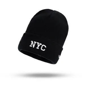 Classic black NYC embroidered knit beanie with warm ribbed texture and folded cuff style