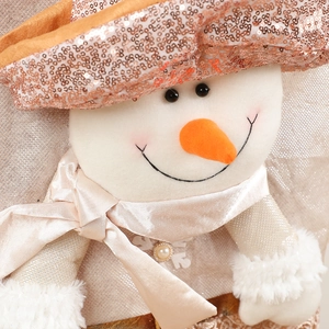 Festive rose gold sequin snowman chair cover with satin scarf and white fur detail